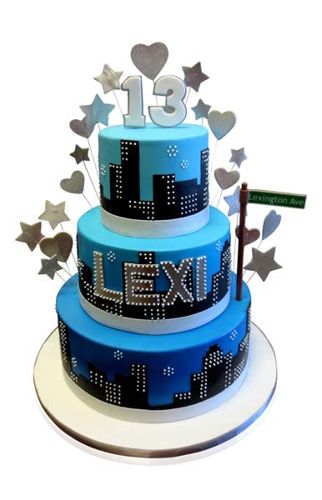 Three-tier blue NYC skyline 13th birthday cake with silver stars by CMNY Cakes