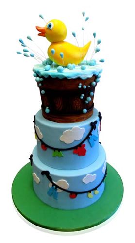 Three-tier rubber ducky baby shower cake with wood-grain and cloud tiers by CMNY Cakes